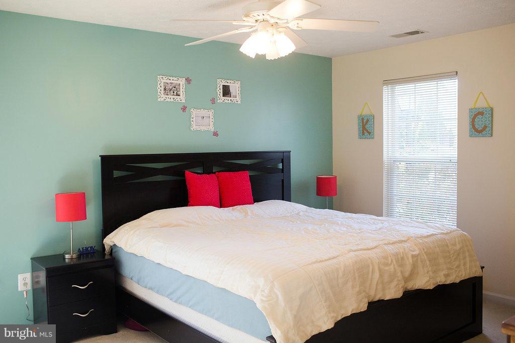 3018 Hunting Ridge Drive, Unit 3018 Owings Mills, MD 21117 - Photo 11 of 30 a bedroom with a bed and a closet