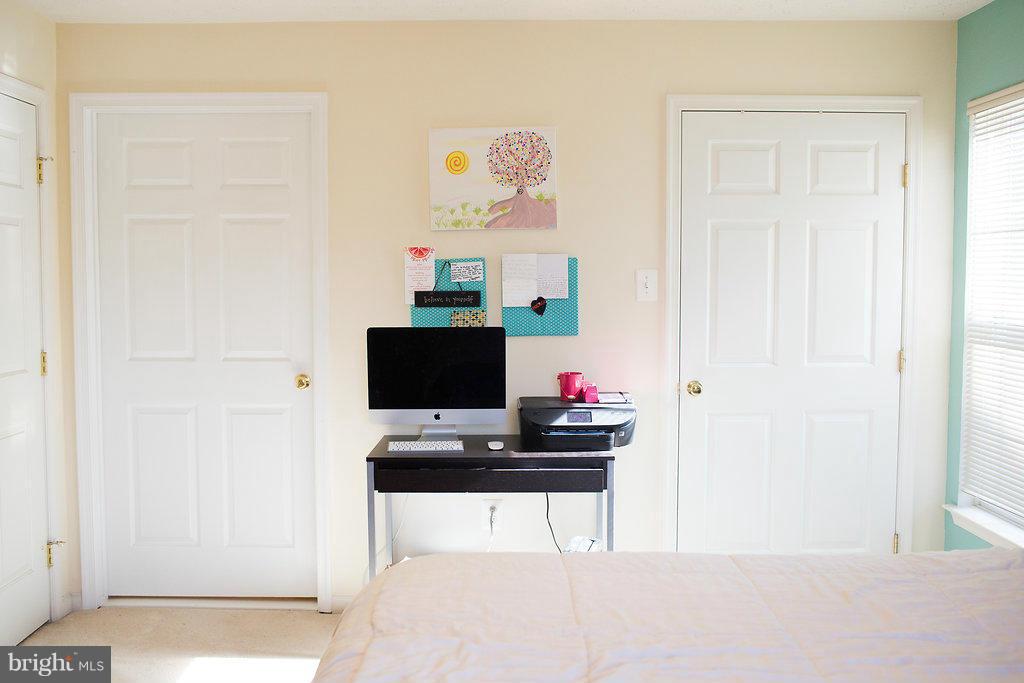 3018 Hunting Ridge Drive, Unit 3018 Owings Mills, MD 21117 - Photo 12 of 30 a workspace with furniture and wooden floor