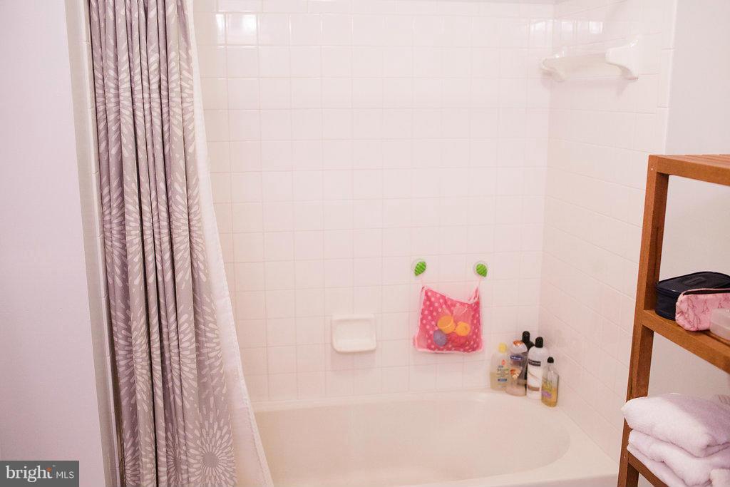 3018 Hunting Ridge Drive, Unit 3018 Owings Mills, MD 21117 - Photo 15 of 30 a bathroom with a white tub