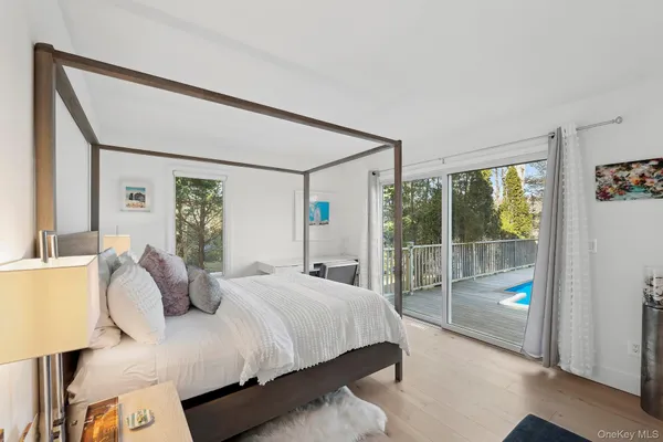 a bedroom with a large bed and a window