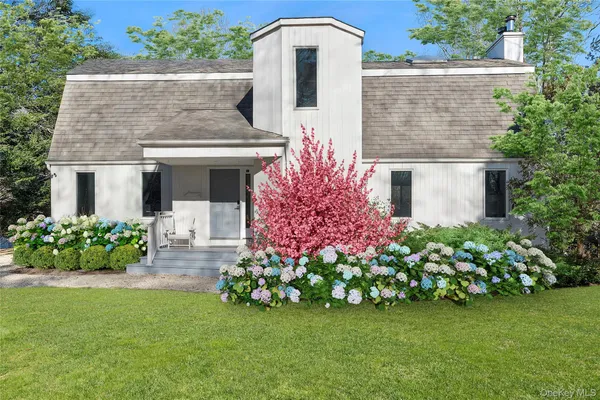 front view of a house with a garden