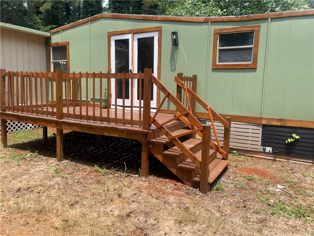 201 Craft Street Calhoun Falls, SC 29628 - Photo 11 of 12 This charming home features an inviting wooden deck, perfect for outdoor enjoyment.