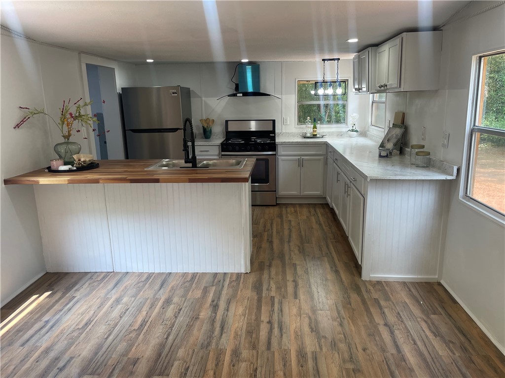 201 Craft Street Calhoun Falls, SC 29628 - Photo 2 of 12 This bright kitchen features ample counter space, modern appliances, and a seamless flow for daily living.