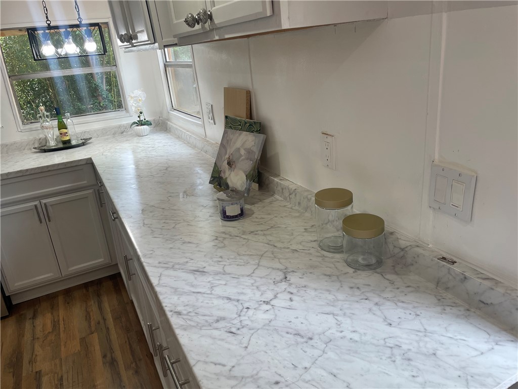 201 Craft Street Calhoun Falls, SC 29628 - Photo 3 of 12 This bright kitchen features durable flooring and ample counter space.