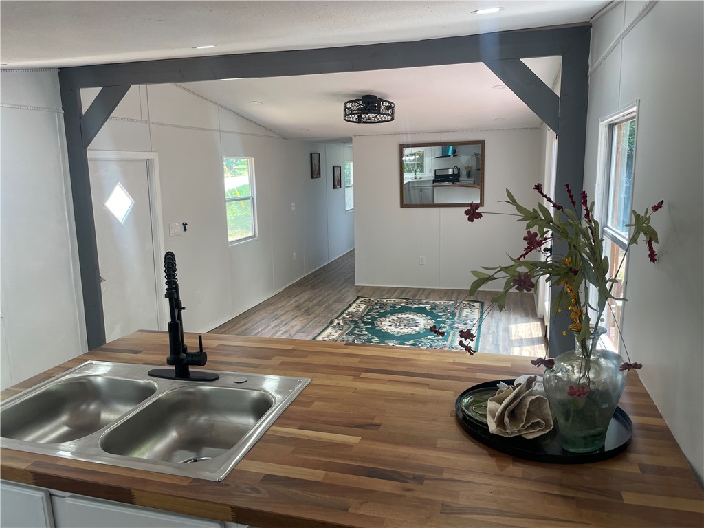 201 Craft Street Calhoun Falls, SC 29628 - Photo 6 of 12 This spacious kitchen offers ample room for culinary endeavors and gatherings.