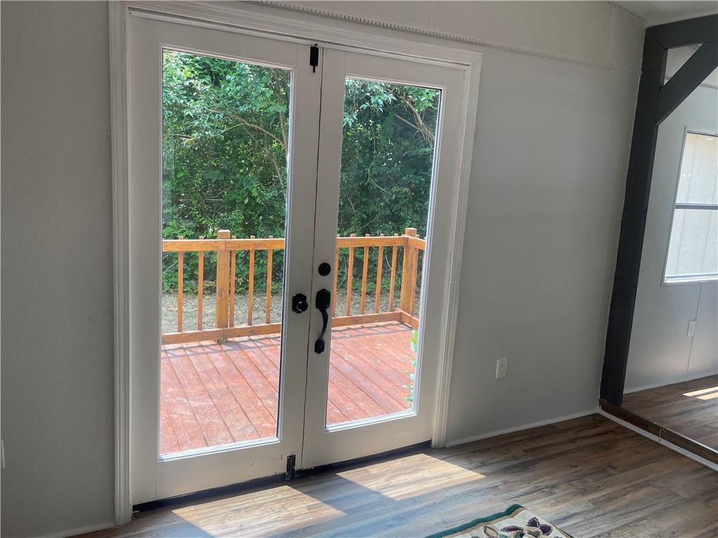 201 Craft Street Calhoun Falls, SC 29628 - Photo 9 of 12 Step outside onto the private deck, a perfect extension of your living space.