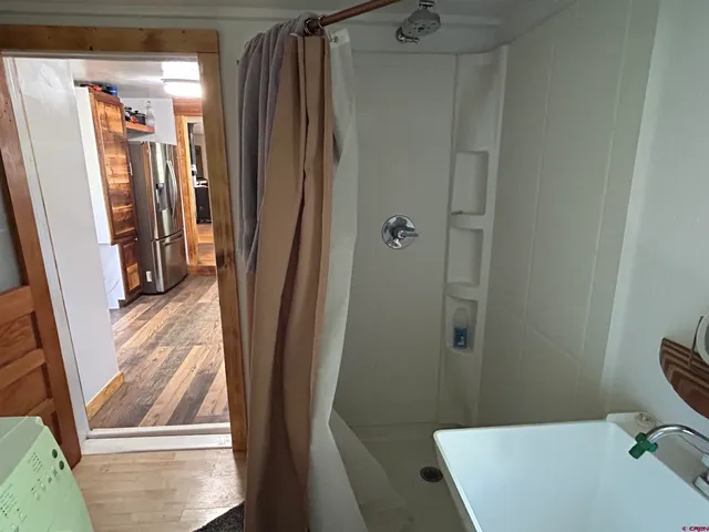 a bathroom with a tub and a shower