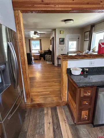 a view of living room with granite countertop furniture and a fireplace
