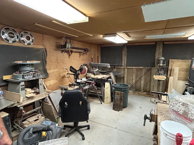 a room with lots of chairs and musical instruments