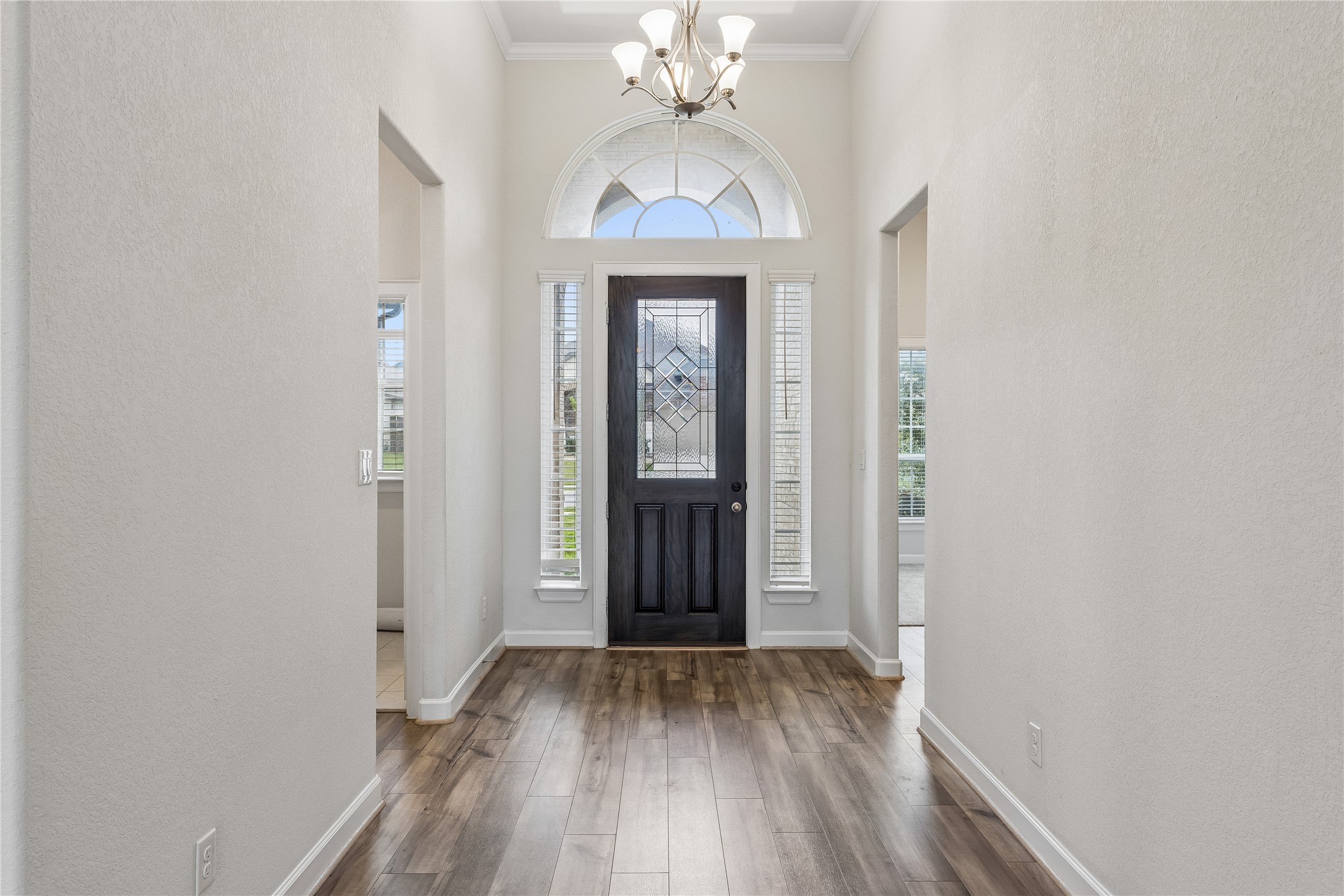 298 Wild Pecan Loop Buda, TX 78610 - Photo 7 of 40 wooden floor in an empty room with a window