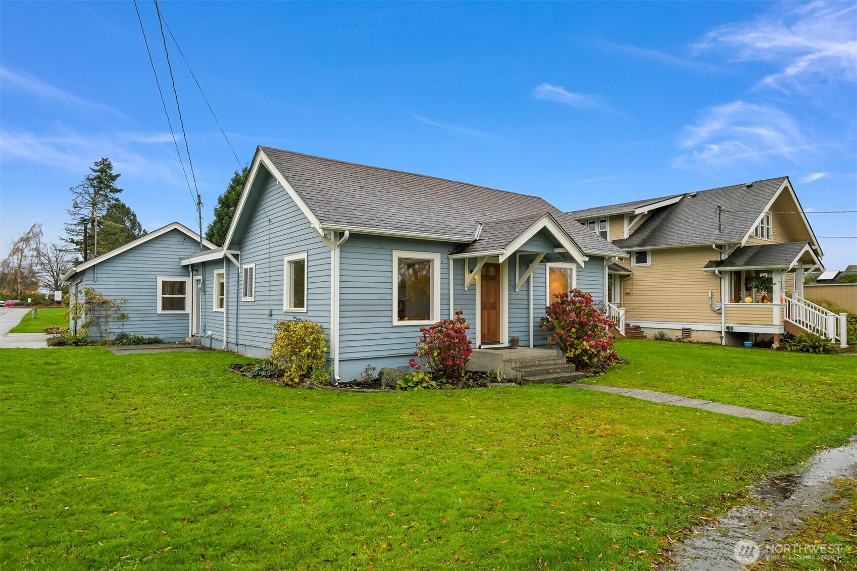 a front view of house with yard and green space