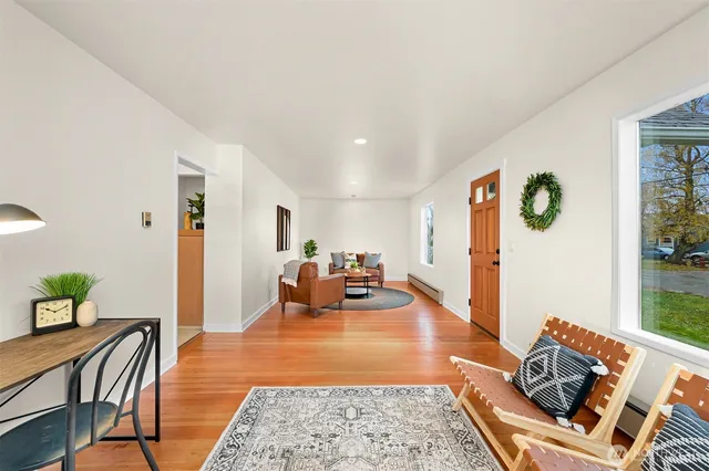 a living room with furniture and a rug