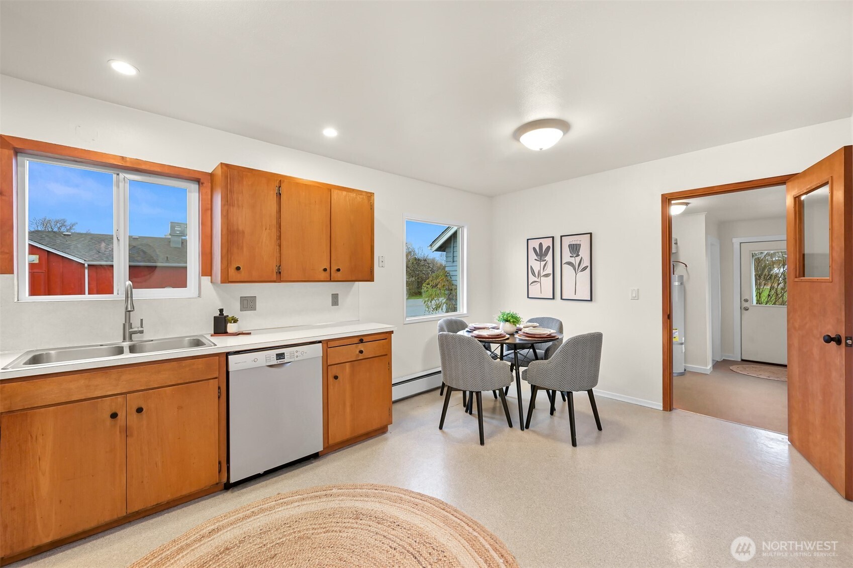 5811 Main Street Bow, WA 98232 - Photo 22 of 40 a kitchen with a sink table and chairs