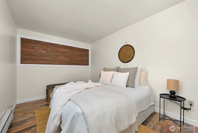 a bedroom with a bed and a chair