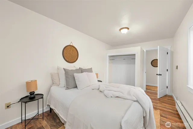 a bedroom with a bed and a lamp