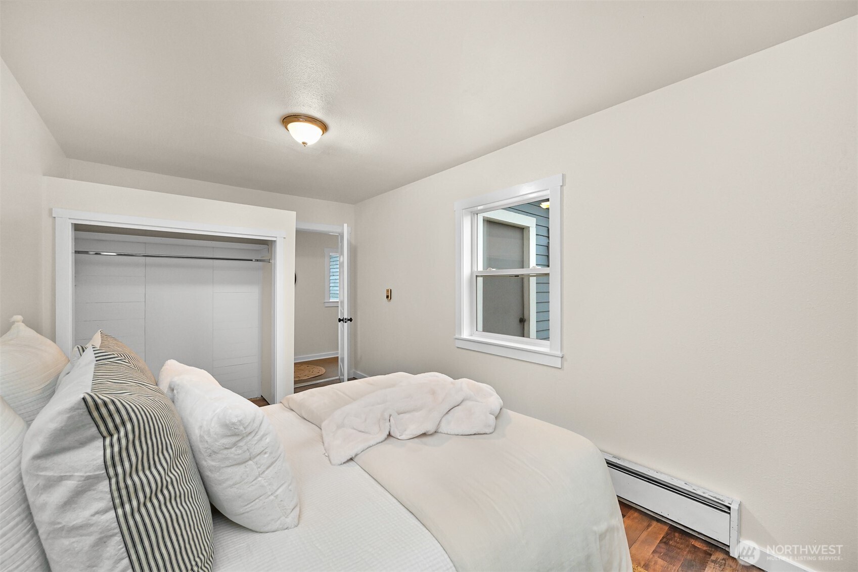 5811 Main Street Bow, WA 98232 - Photo 28 of 40 a bedroom with a bed and a window