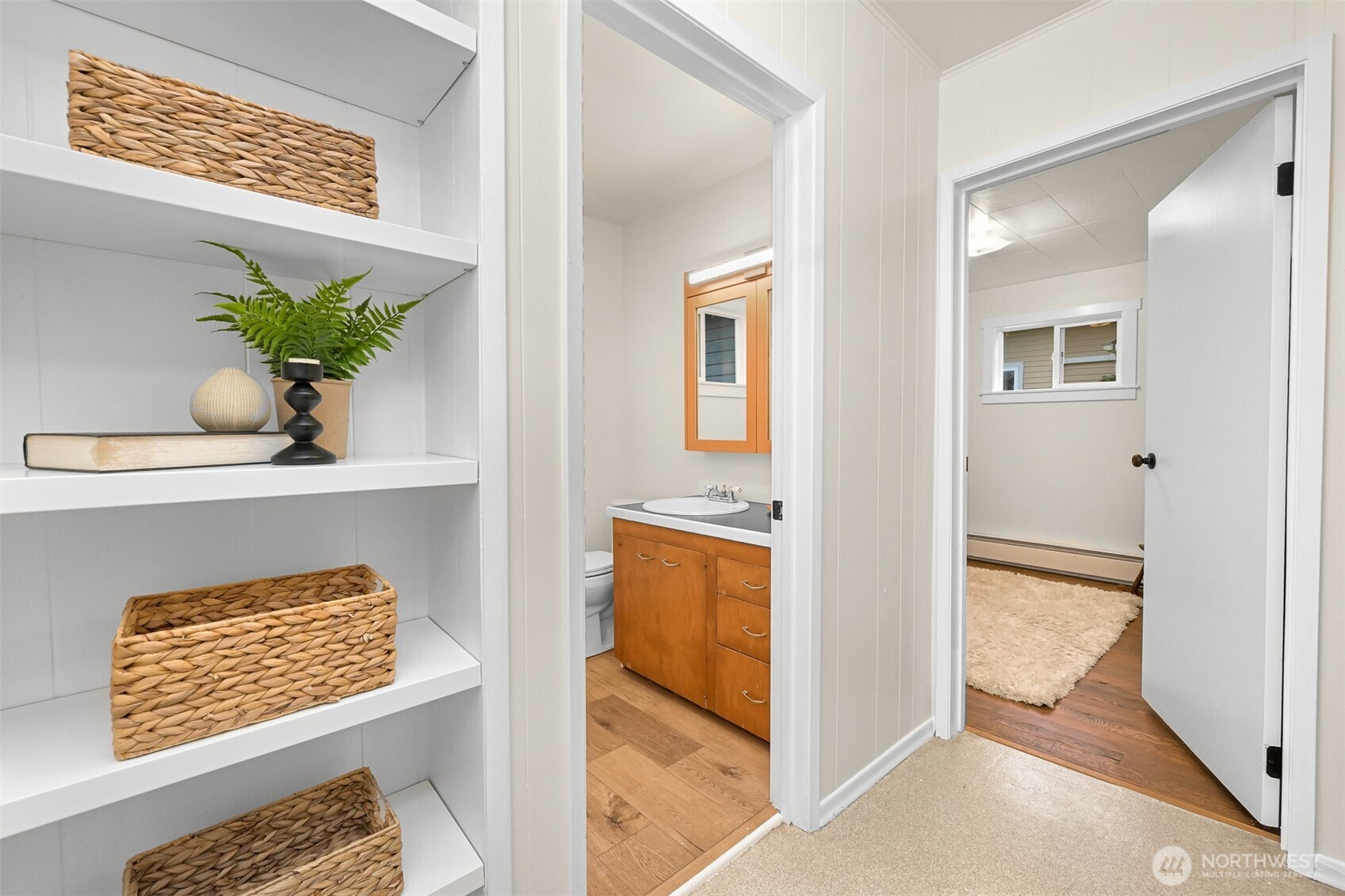 5811 Main Street Bow, WA 98232 - Photo 31 of 40 a view of hallway with cabinets and wooden floor