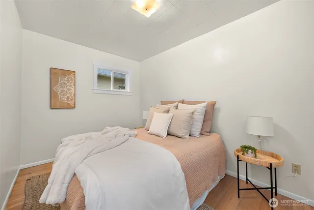 a bedroom with a bed and chair