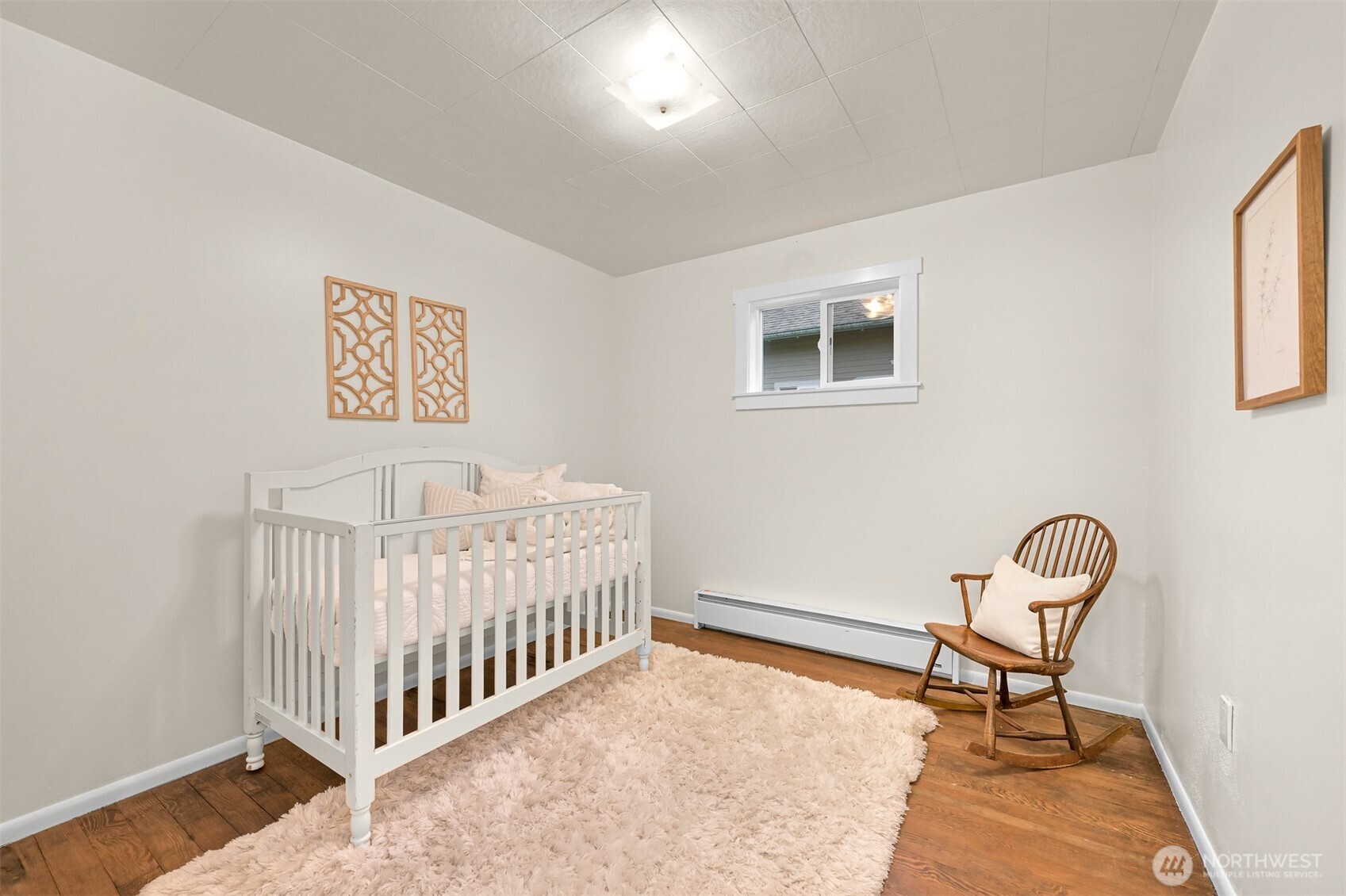 5811 Main Street Bow, WA 98232 - Photo 33 of 40 a bedroom with a bed and chair