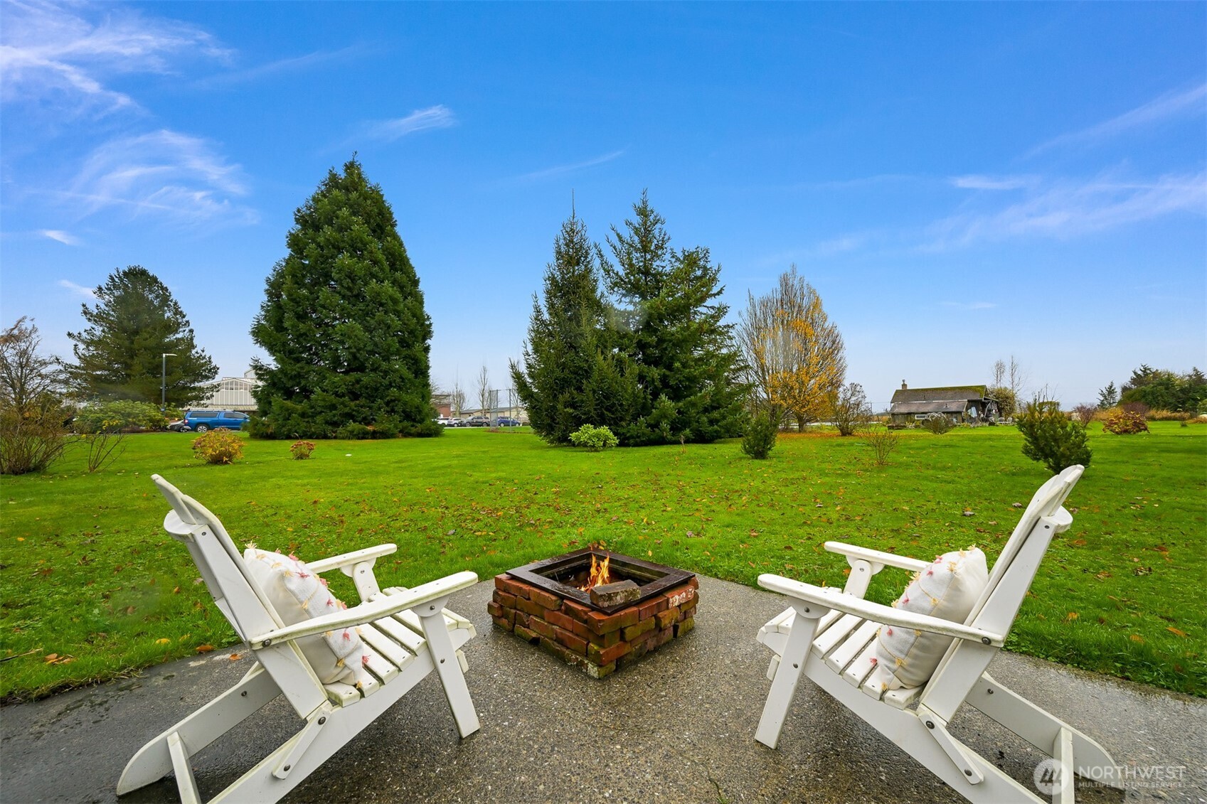 5811 Main Street Bow, WA 98232 - Photo 36 of 40 a view of a table and chairs in the garden
