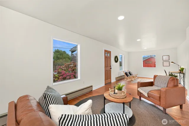 a living room with furniture and a rug