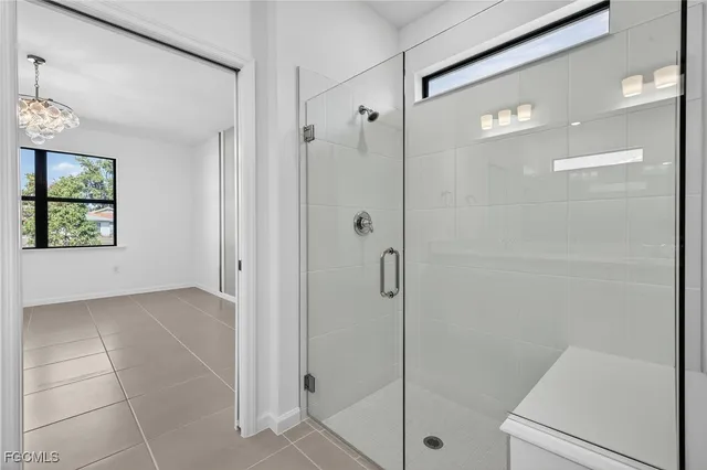 a bathroom with a shower and a sink