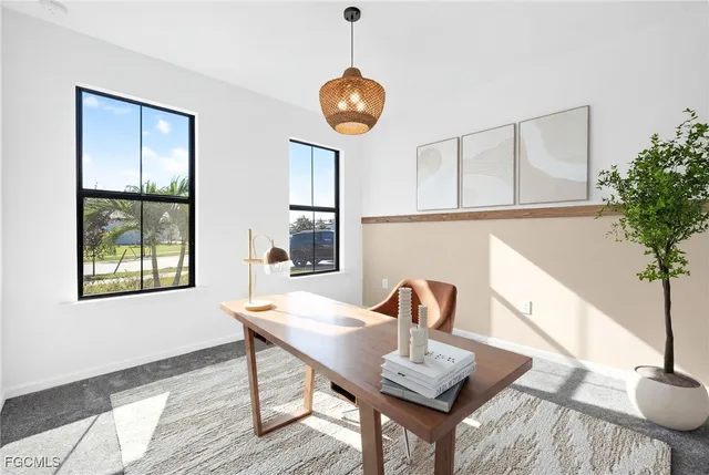 a view of a dining room with furniture and window