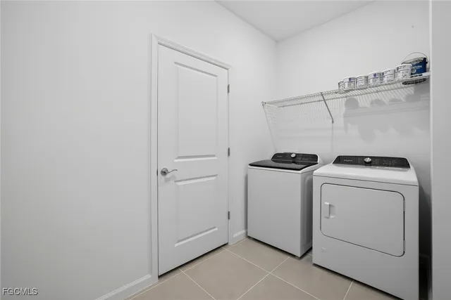 a view of storage and utility room with washer and dryer