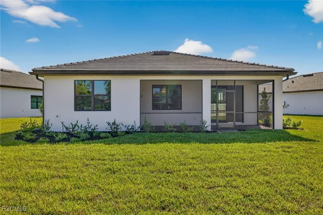 a view of a house with a garden