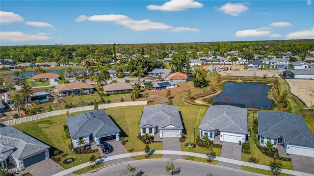 an aerial view of residential houses with outdoor space and street view