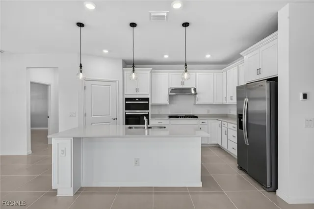 a large kitchen with cabinets