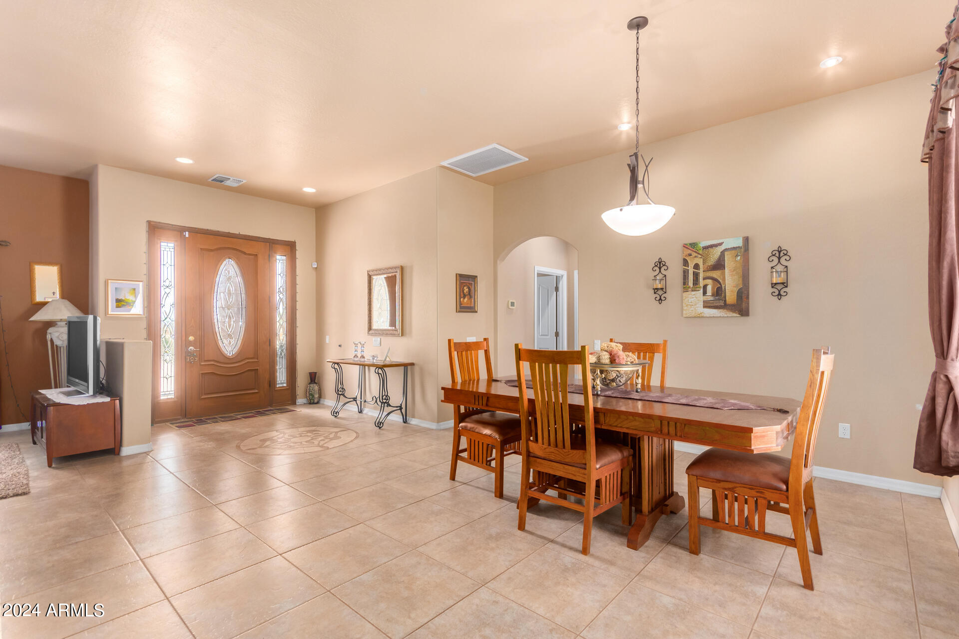 6786 Gelding Lane Coolidge, AZ 85128 - Photo 14 of 39 a view of a a dining room with furniture window and outside view