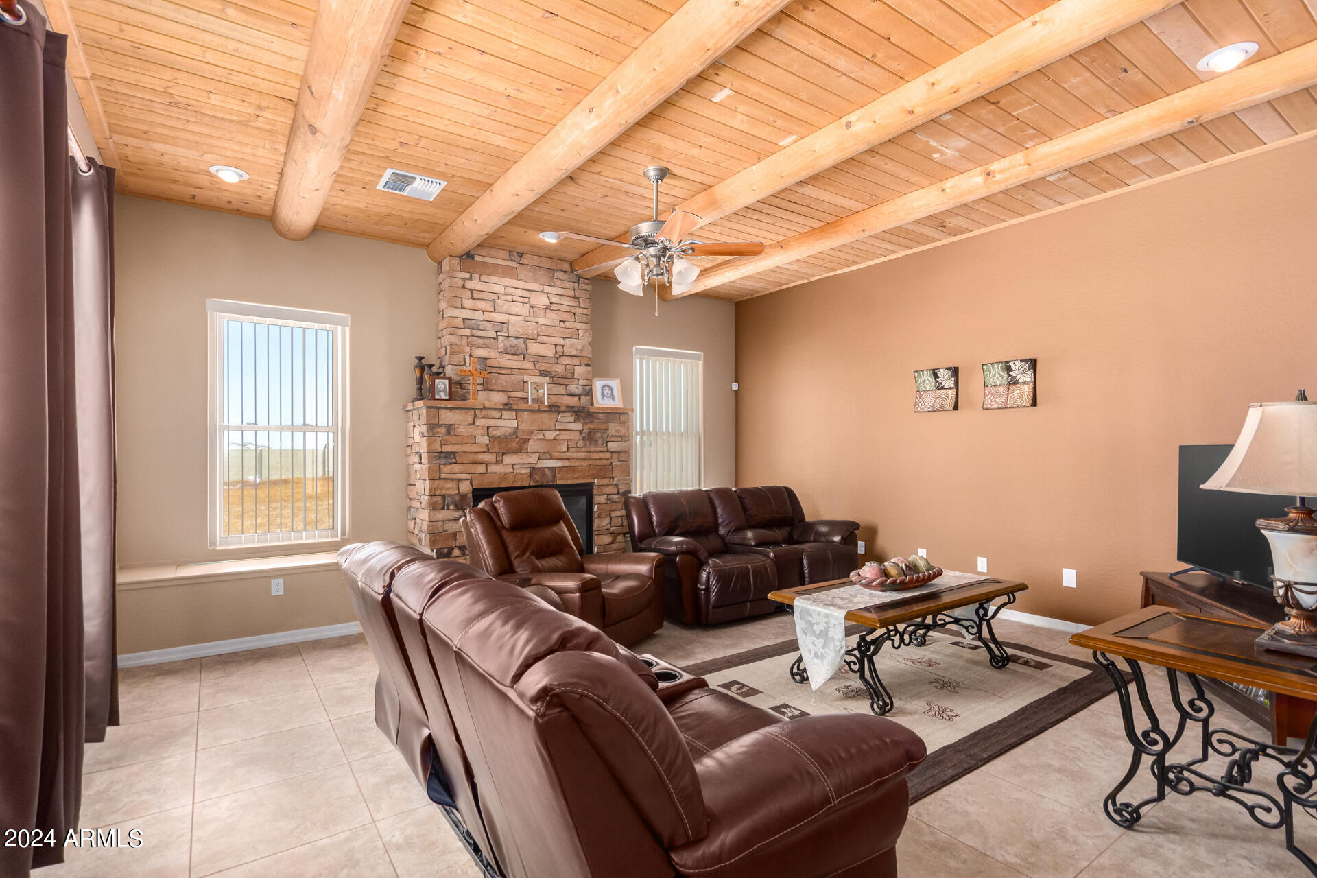 6786 Gelding Lane Coolidge, AZ 85128 - Photo 20 of 39 a living room with furniture a fireplace and a large window