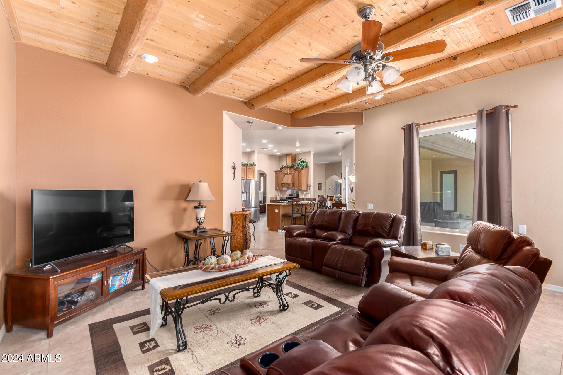 6786 Gelding Lane Coolidge, AZ 85128 - Photo 21 of 39 a living room with furniture and a flat screen tv