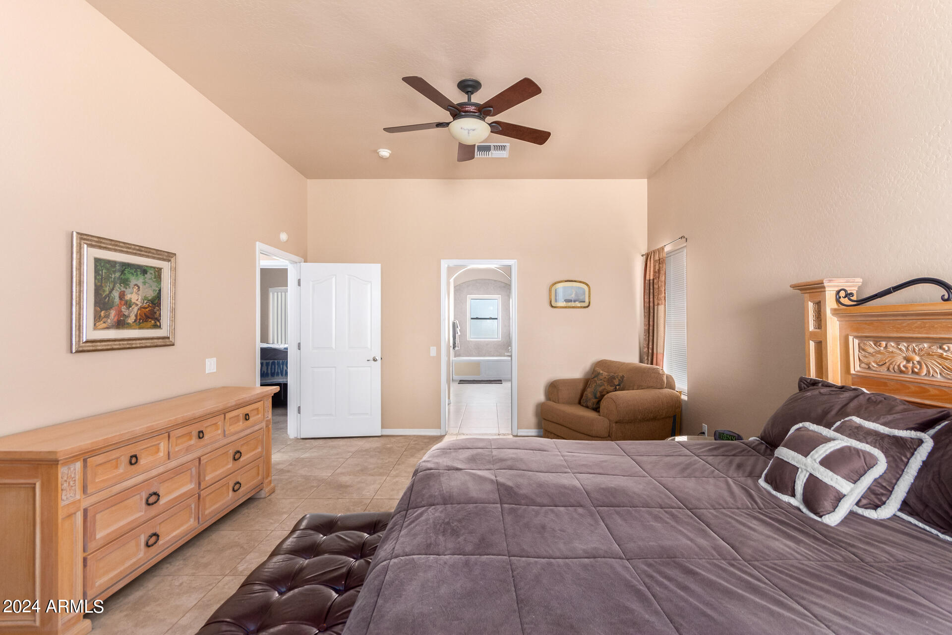 6786 Gelding Lane Coolidge, AZ 85128 - Photo 26 of 39 a bedroom with a bed and window