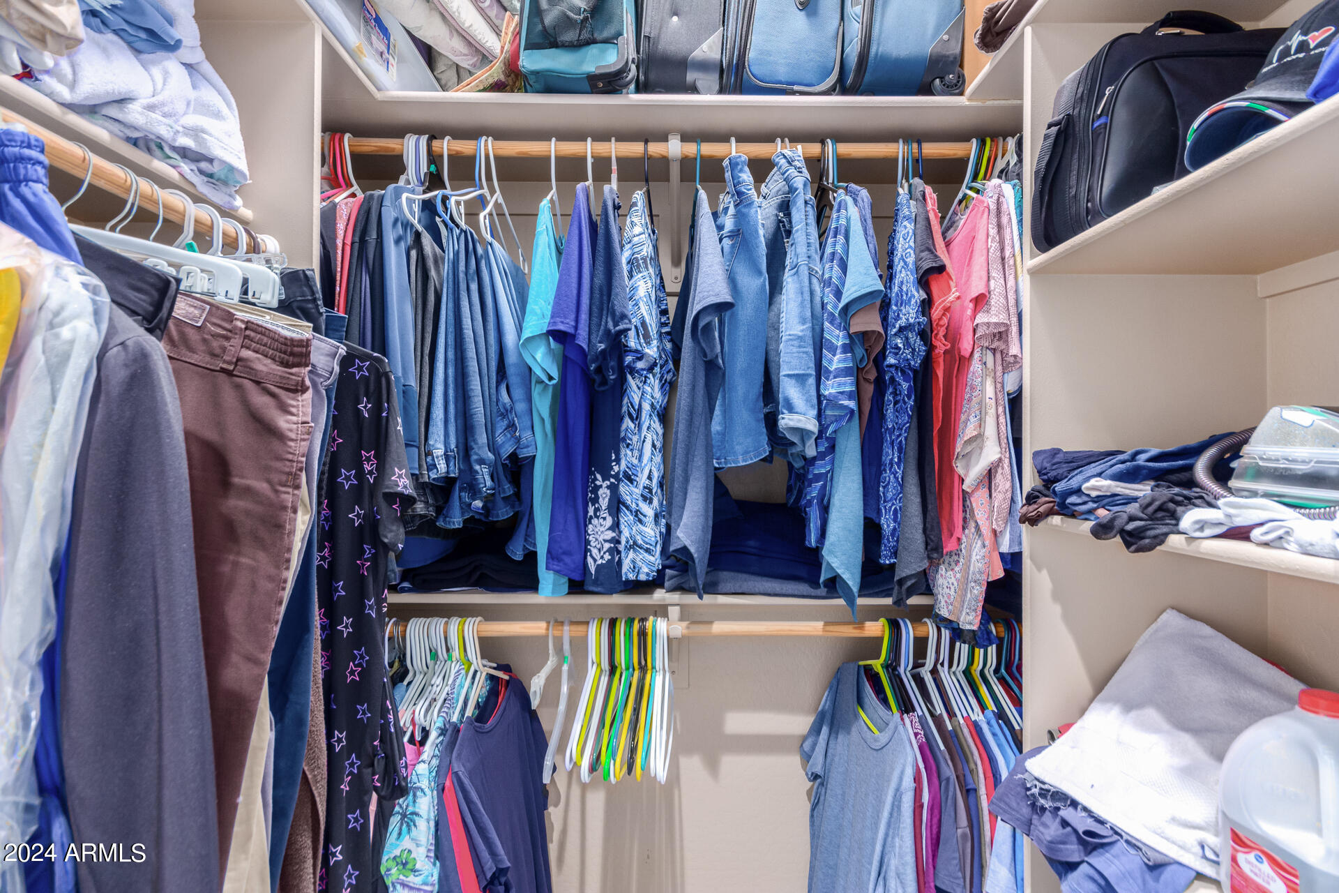 6786 Gelding Lane Coolidge, AZ 85128 - Photo 31 of 39 a view of walk in closet with clothes