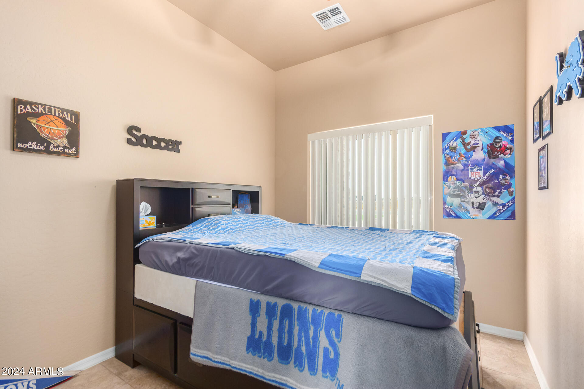 6786 Gelding Lane Coolidge, AZ 85128 - Photo 32 of 39 a bedroom with a bed and painting on the wall