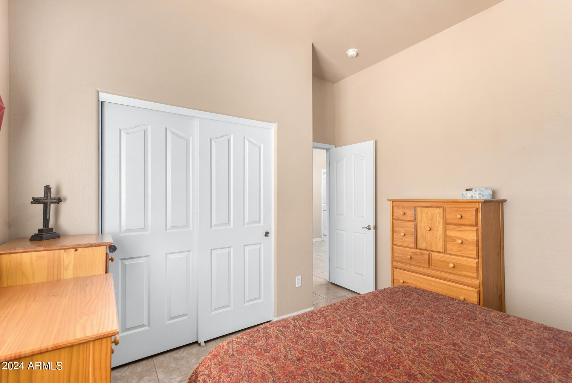 6786 Gelding Lane Coolidge, AZ 85128 - Photo 35 of 39 a bedroom with a bed and a cabinets