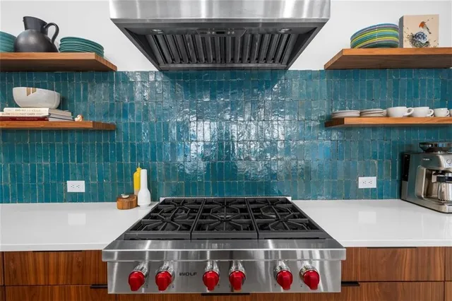 a view of a patio with table and chairs