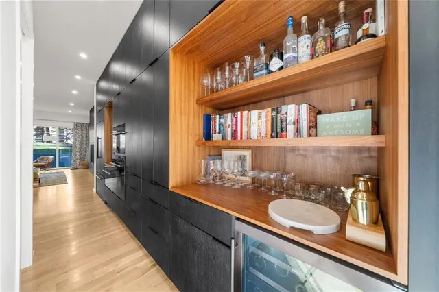 a living room with furniture and flowers