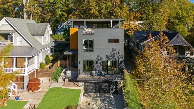 a front view of a house with outdoor seating