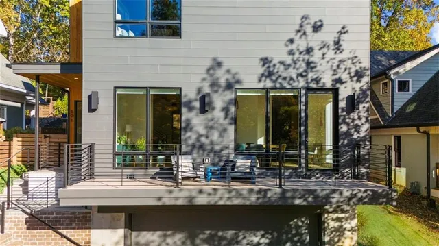 a bedroom with a large bed and a large window