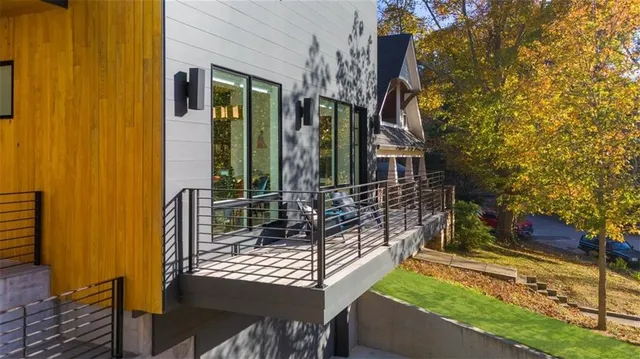 a bedroom with a large bed and a flat screen tv