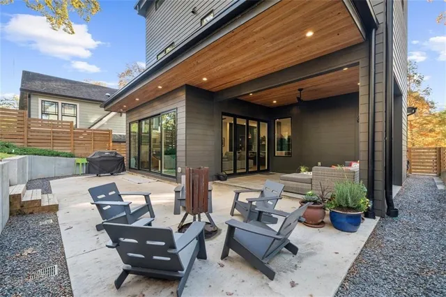 a view of a hallway with wooden floor and cabinet