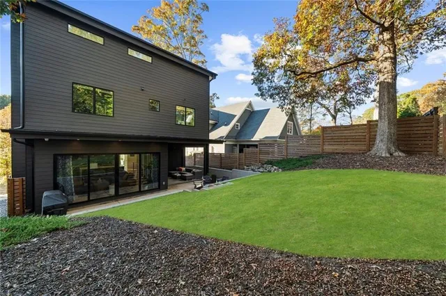 a bathroom with a sink mirror toilet and shower
