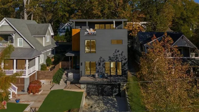 a view of a hallway with wooden floor and stairs