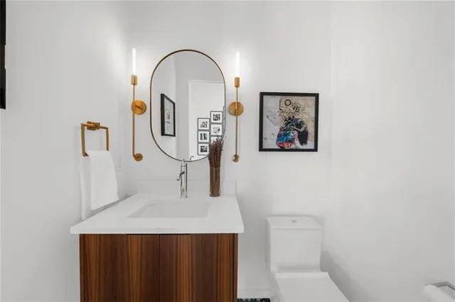 a view of a hallway with wooden floor and entryway