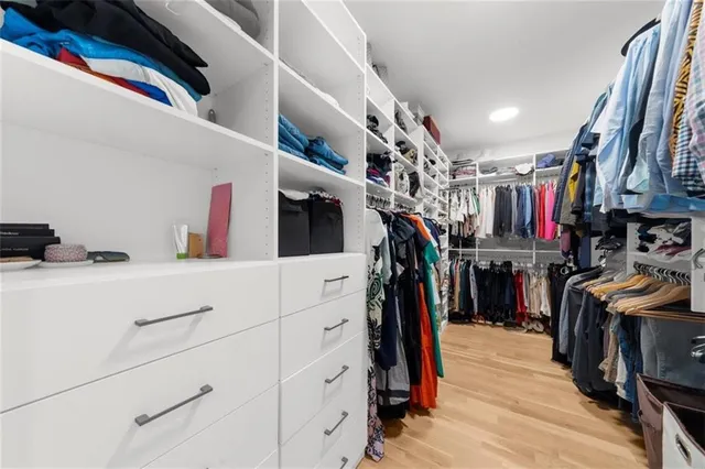a view of a patio with couches chairs and a potted plant