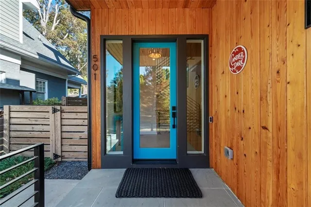 a kitchen with stainless steel appliances granite countertop a sink and a white cabinets