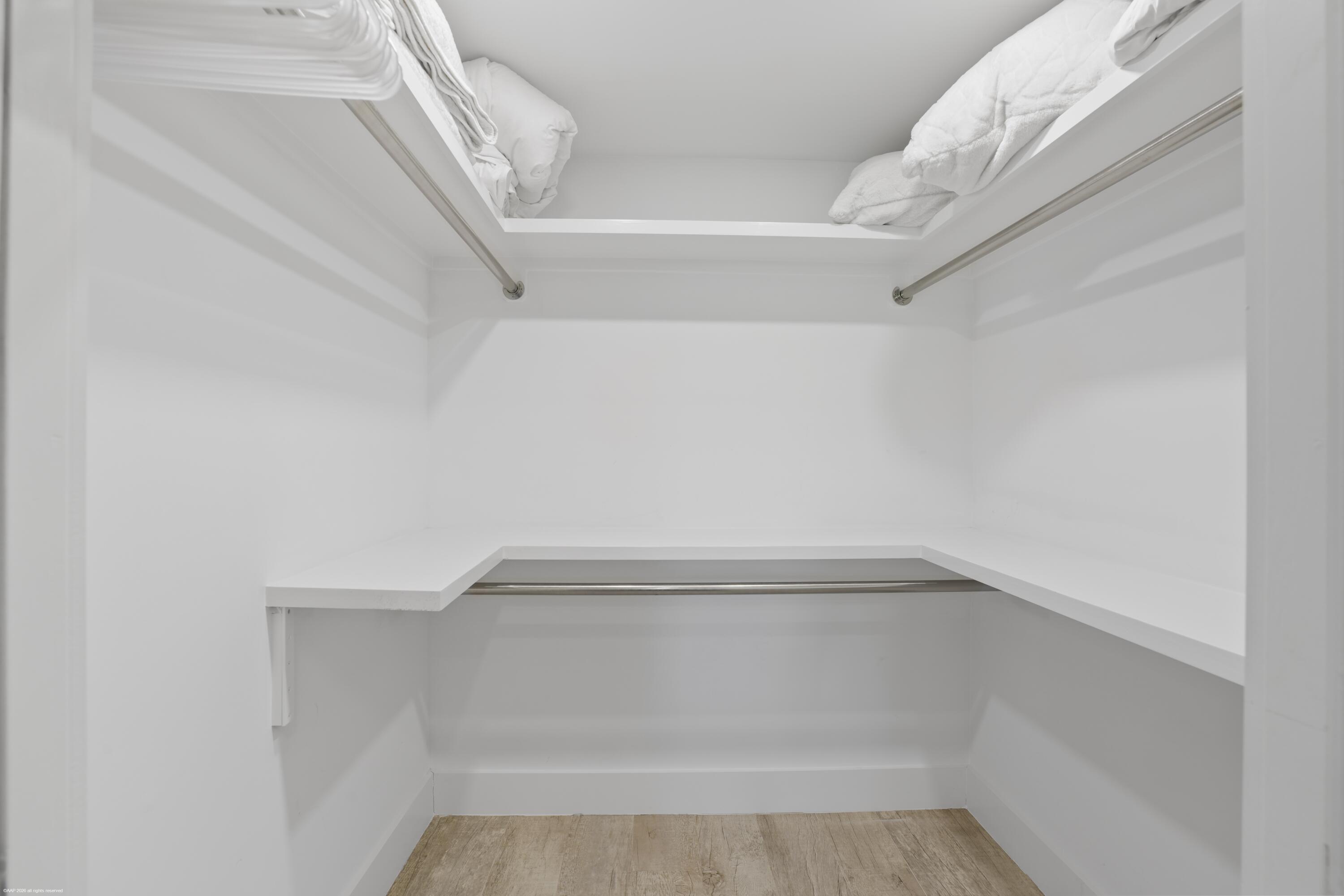 13334 Polo Club Road, Unit 234 Wellington, FL 33414 - Photo 16 of 41 a view of walk in closet with empty racks